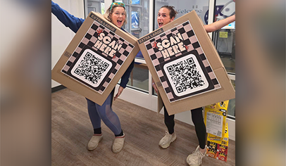 Volunteers Are Wearing Giant QR Codes in the Pick-up Line—and Parents Are Actually Scanning Them